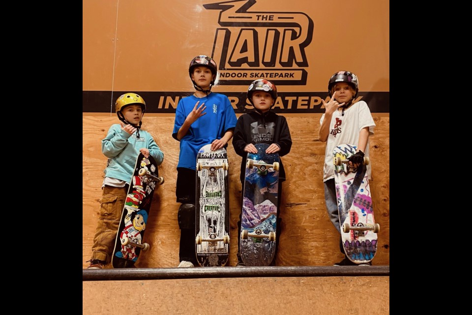 Dillon, Jack, Ben and Hudson show off their boards at The Lair Indoor Skatepark in Port Coquitlam, which is closing down this weekend.