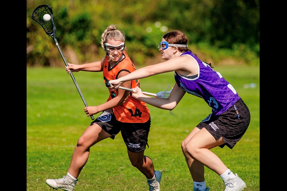 Port Coquitlam's Mariah Whitfield (left) in field lacrosse action. She's set to play for the University of Indianapolis starting in the 2024 season.