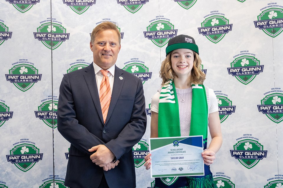 Tri-Cities Predators' Taylor Gray (right) with former Vancouver Canuck Cliff Ronning after receiving a $1,000 scholarship at the 2021 Pat Quinn Classic tournament.