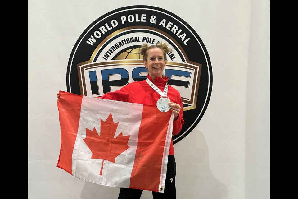 Rosanne Marshall, who grew up in Port Coquitlam but now lives in Verona, Italy, celebrates her silver medal in the artistic pole dancing competition at the recent World Pole and Ariel Championships in Kielce, Poland.
