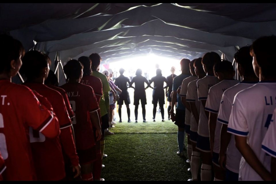 Players from two Chinese teams line up for the girls' final at the 2023 World School Football Championships in Rabat, Morocco.