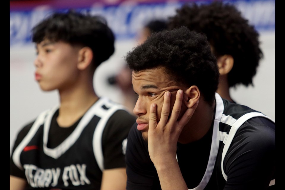 The Terry Fox Ravens watch their unlikely dream of playing for a BC School Sports AAAA boys basketball championship run away from them in a 92-64 loss to the Dover Bay Dolphins in their semi-final game, Friday at the Langley Events Centre.