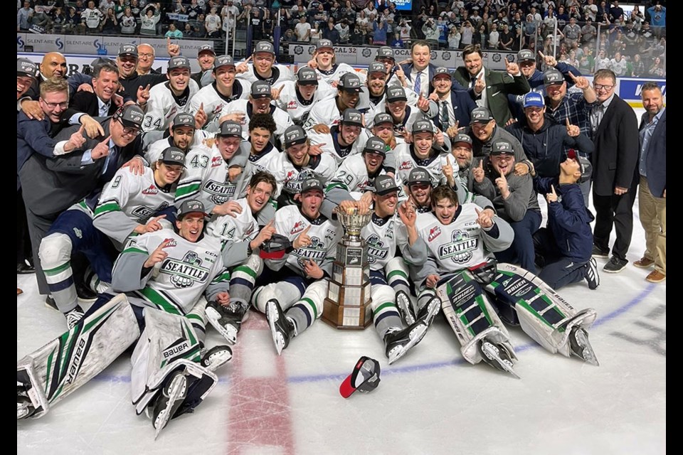Coquitlam's Thomas Milic (front left) smiles with his Seattle Thunderbirds teammates after winning the 2023 WHL championship on Friday (May 19).