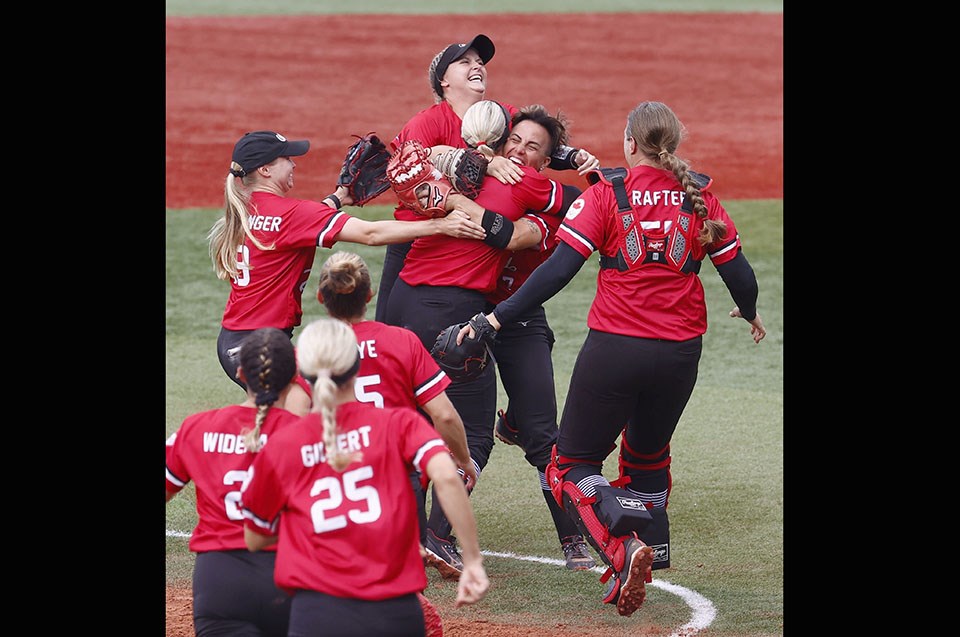 Port Coquitlam's Jenn Salling (#7) is embraced by her teammates after Canada claimed the bronze medal in a 3-2 win over Mexico at the Tokyo 2020 Olympics.