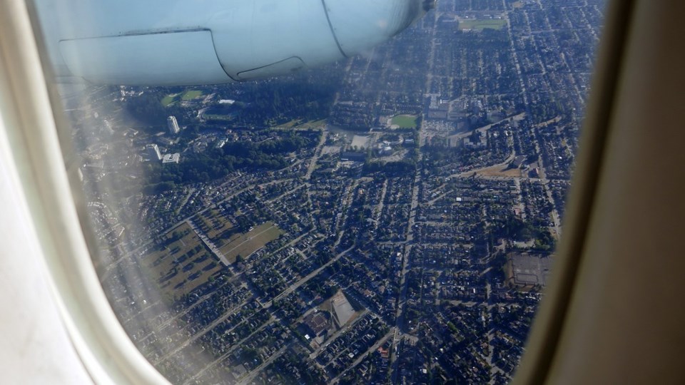 airplanewindowoverheadhousescityvancouvergettyimages