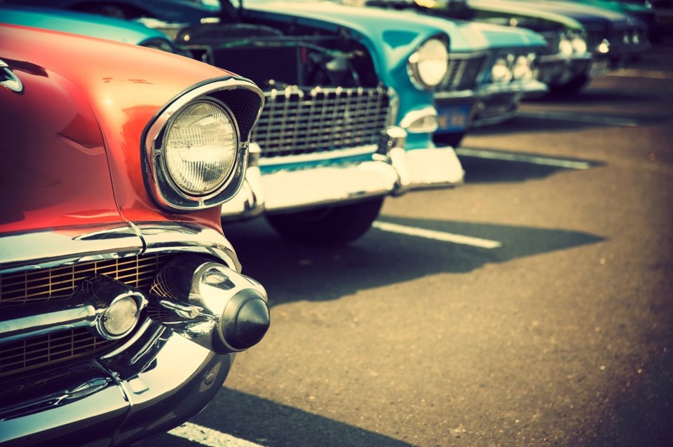 Vintage cars vehicles in a parking lot - Getty Images
