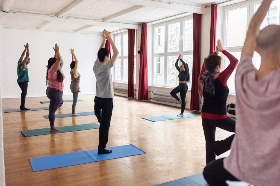 yogaclasstreeposematinstructor-getty-images