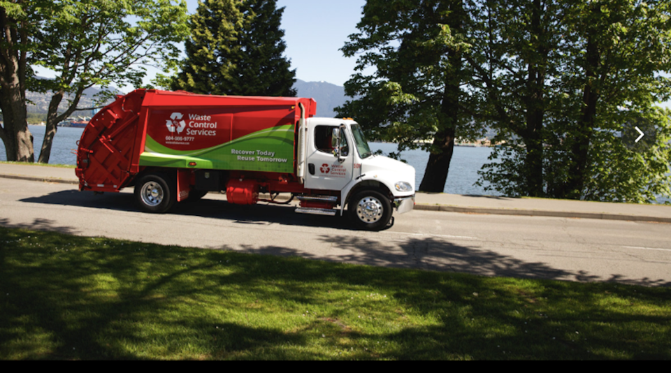 a-waste-controll-services-truck-on-a-sunny-day-near-the-water