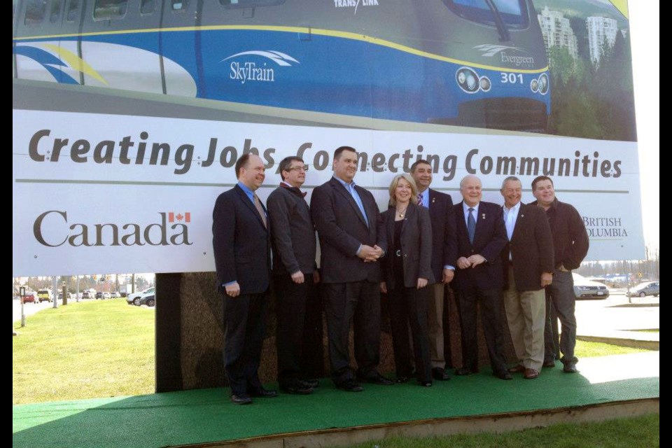 The Evergreen Extension line of TransLink's SkyTrain was first announced in March 2013. Featured in the photo [from left to right] are then Coquitlam-Burke Mountain MLA Douglas Horne, TransLink CEO Ian Jarvis, Port Moody-Coquitlam-Port Coquitlam MP James Moore, BC Minister of Transportation and Infrastructure Mary Polak, Surrey-Tynehead MLA Dave Hayer, New Westminster Mayor Wayne Wright, Langley Mayor Peter Fassbender and Port Moody Mayor Mike Clay.