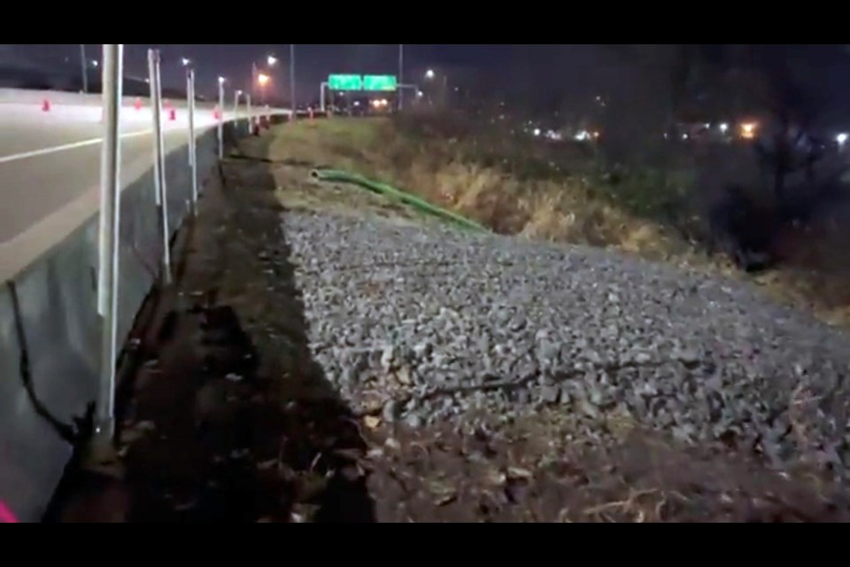 Groups against the Trans Mountain pipeline raised concerns over an apparent sinkhole off Port Coquitlam's Mary Hill Bypass on Dec. 1, 2021. The company says the recent rainstorms caused a settlement and crews are working to repair the damage.