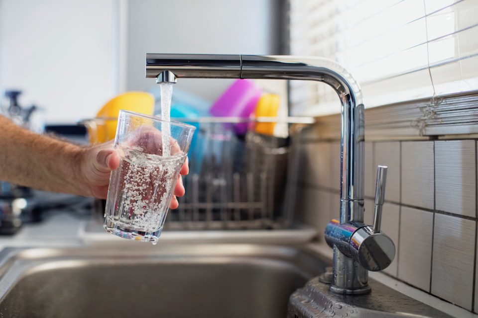 tap-pouring-water-into-class-getty-images