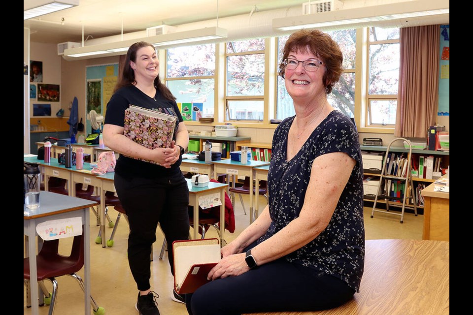 Kim Kroeker, centre, said she felt "nostalgic" to be back in her former classroom, where she taught for over 30 years at Mundy Road Elementary. Her daughter Kelly is now a kindergarten teacher at the school, which is celebrating its 75th anniversary on June 16. | Mario Bartel, Tri-City News