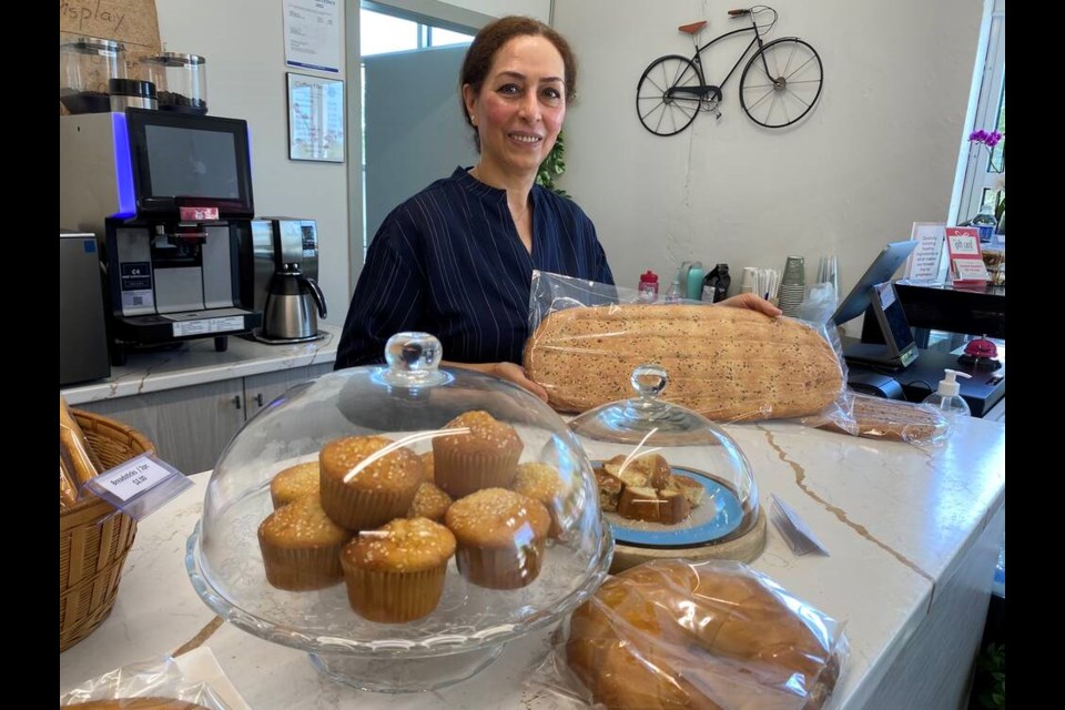 A new Persian bakery has opened up in the new Dominion Triangle area of Port Coquitlam. Owner Maryam Fathi serves up a loaf of flat bread at Sahar Bakery, which she co-owns with her husband Saeid Sayyadi. | Diane Strandberg, Tri-City News 