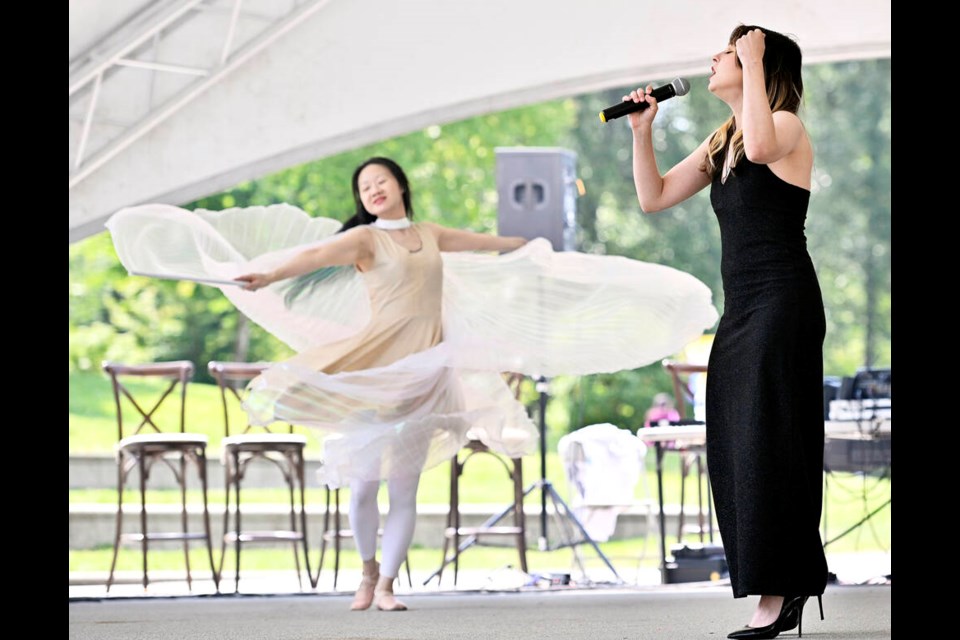 Ukrainian singer Alex Makhavkina performs Let It Go in Russian as Maple Lee dances during Low Entropy's festival, Multicultural Connections, at Town Centre Park last Saturday (July 8). | Jennifer Gauthier, Tri-City News 