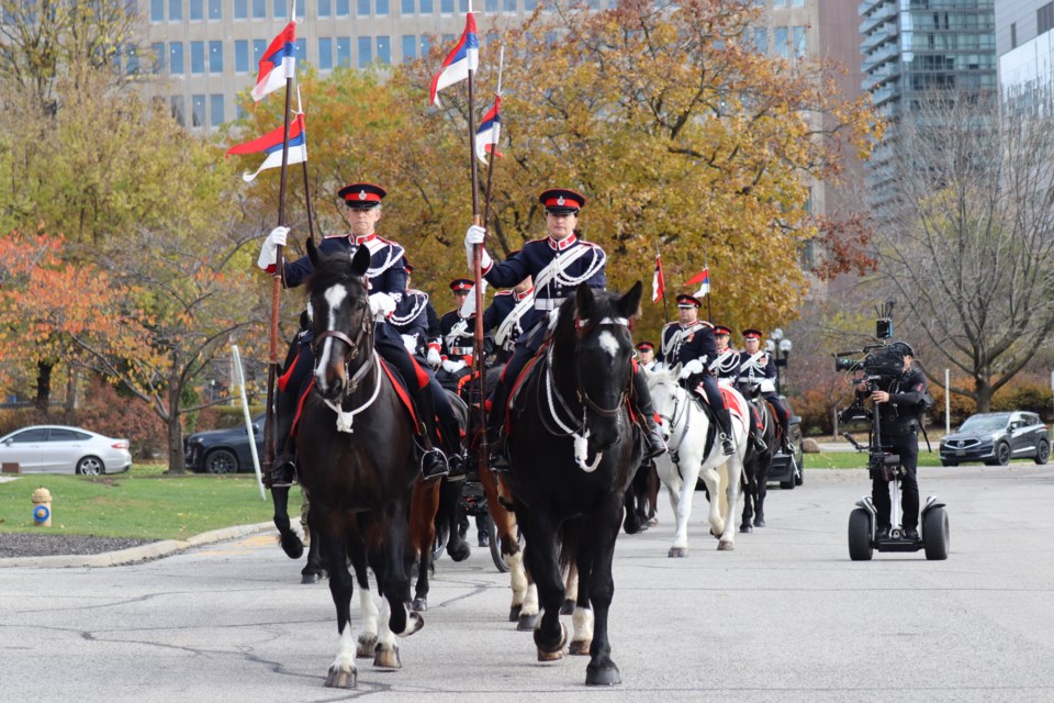 The Governor General's Horse Guards lead lieutenant-governor Edith Dumont's carriage to the grounds of Queen's Park on Nov. 14, 2023. 