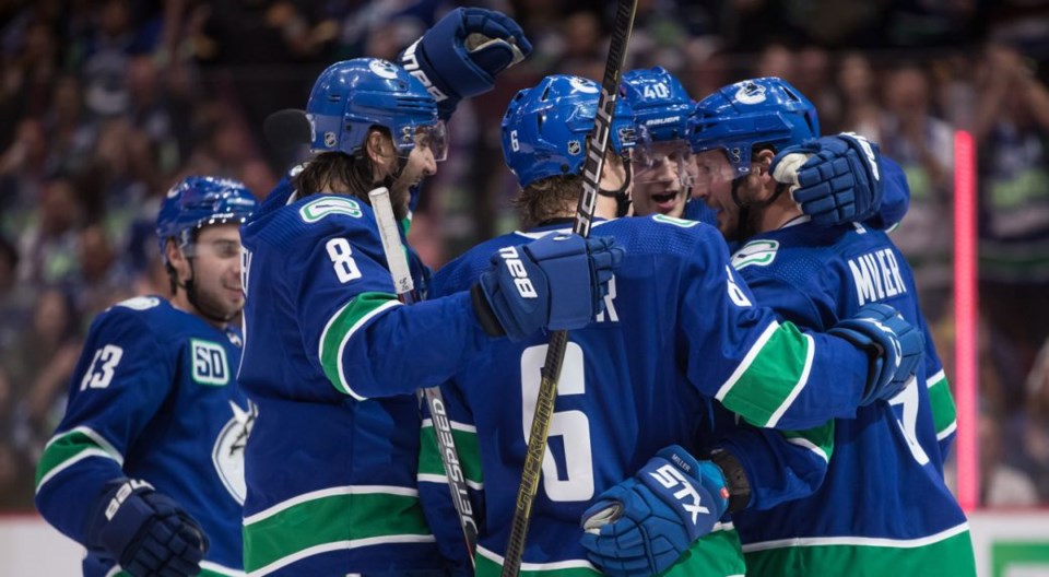 canucks-kings-hugging-team-darryl-dyck-cp