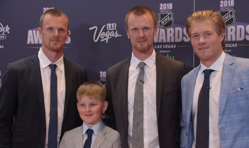 Daniel and Henrik Sedin with Brock Boeser