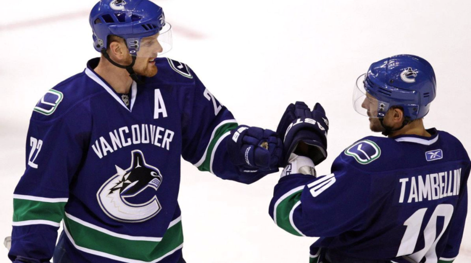 Daniel Sedin and Jeff Tambellini - Darryl Dyck - CP