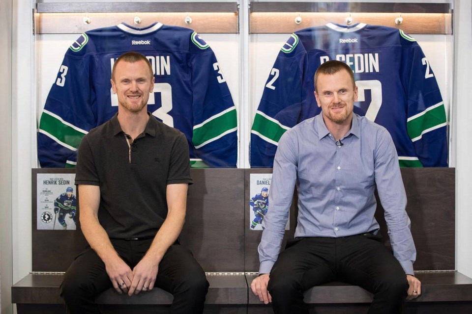 Canucks honour Daniel and Henrik Sedin with jersey retirement ceremony 