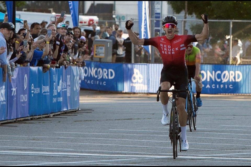 Cole Glover celebrates as he crosses the finish line to win the men's elite race at the Tour de Concord.