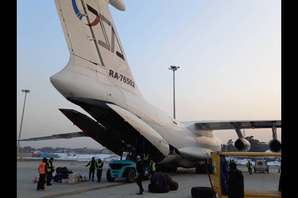 The plane being loaded in Kabul.