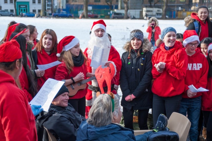 apolline-de-schaetzen-plays-carols-on-her-ukulele-during-a-visit-to-oppenheimer-park-before-christma