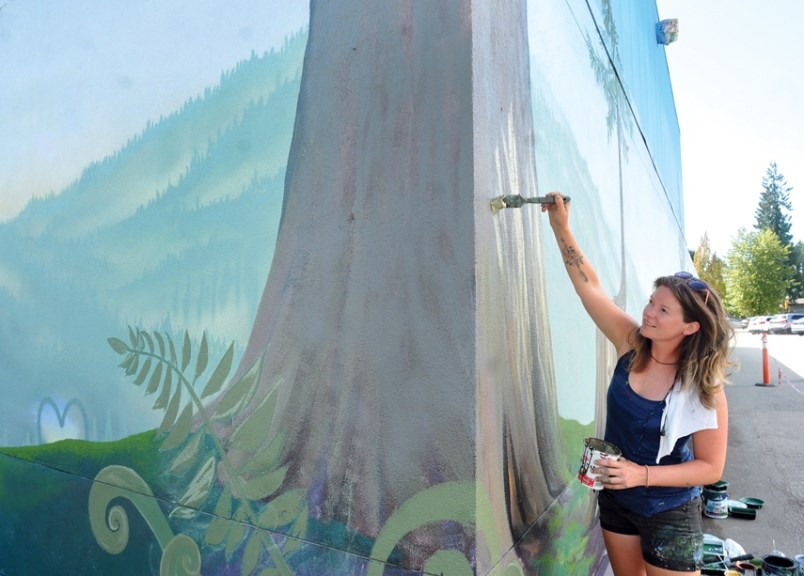 Vancouver artist Emily Gray works on her mural in North Vancouver. Photo by Paul McGrath/North Shore News