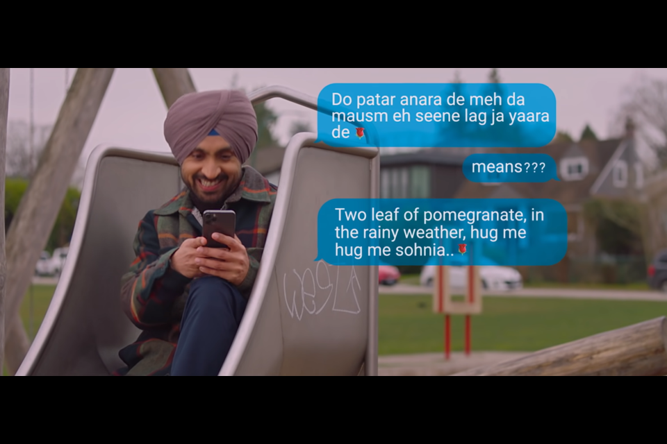 A screen capture from the trailer for Honsla Rakh shows Diljit Dosanjh hiding in a slide working on his Punjabi-English translations.