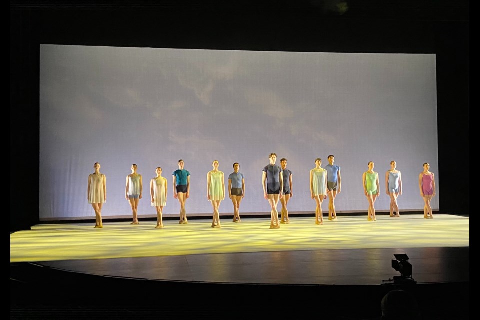 Dancers are on stage rehearsing one of their pieces for the show.