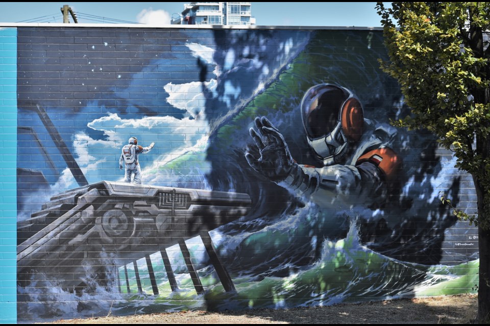 Dimitri Sirenko's 'The Reflection' mural was painted in collaboration with the Polish Consulate as part of the 2021 Vancouer Mural Festival.