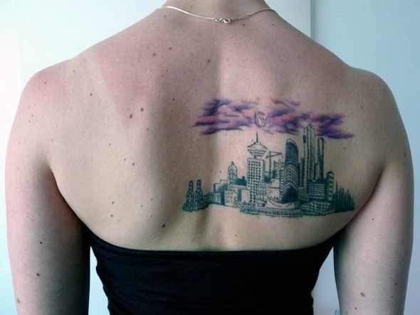 Rachel got a tattoo based on a stylized sketch her friend did of a photo Rachel took of the skyline. The tattoo was done by Rene Botha at Liquid Amber Tattoo.