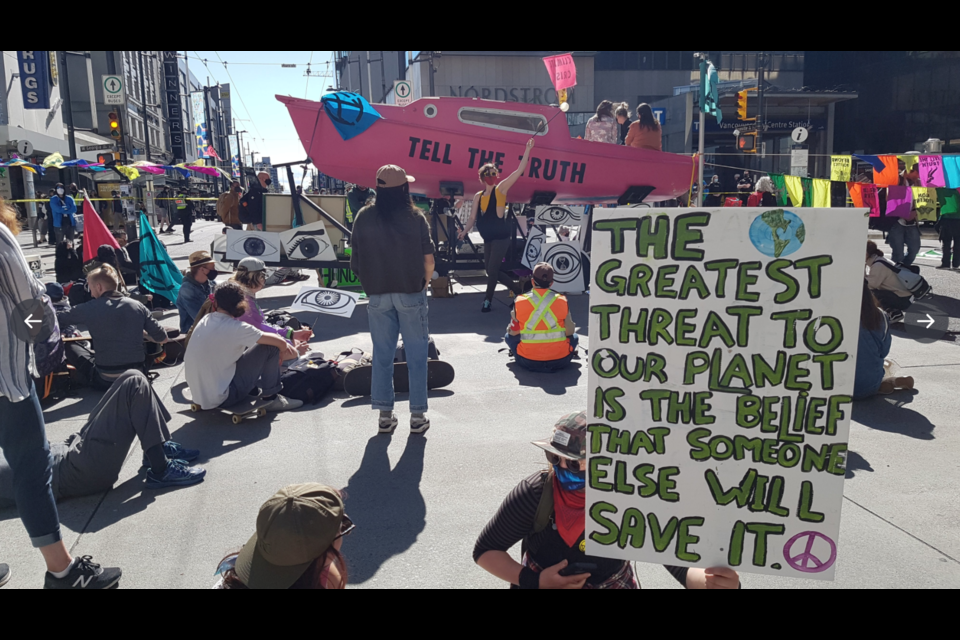 Protestors from Extinction Rebellion's 鶹ýӳchapter gathered at the intersection of Georgia and Granville streets on Saturday, May 1 to urge action in the face of a climate emergency.