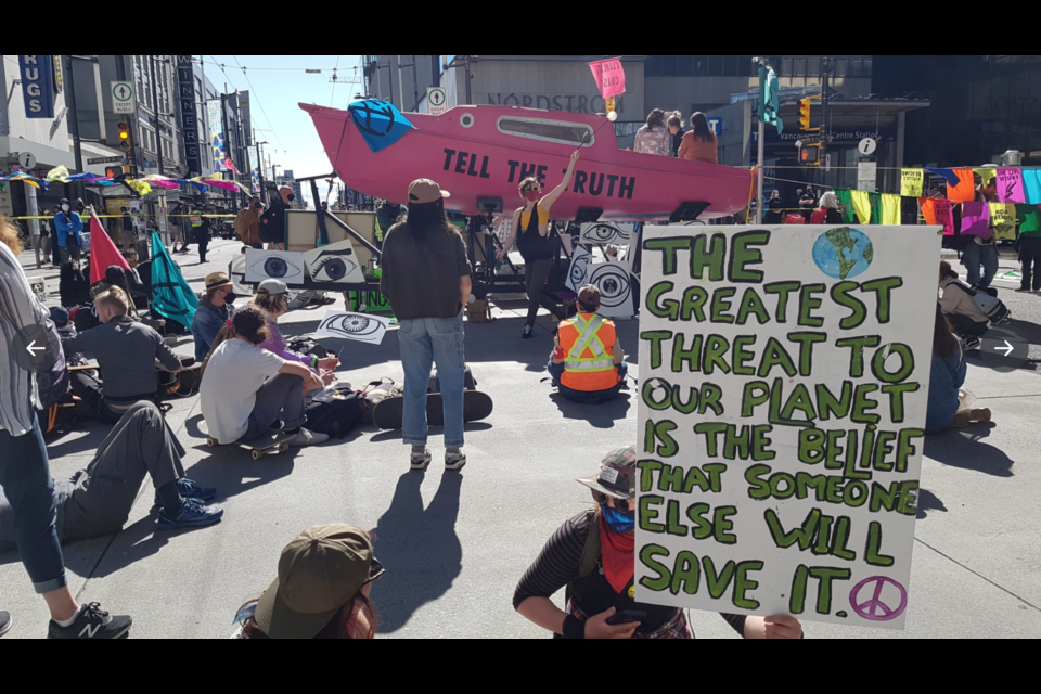 Protestors from Extinction Rebellion's Vancouver chapter gathered at the intersection of Georgia and Granville streets on Saturday, May 1 to urge action in the face of a climate emergency.