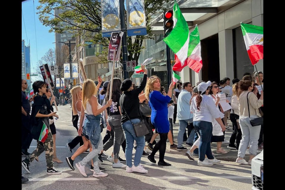 Protesters gather in downtown Vancouver on Saturday, Oct. 1, 2022.