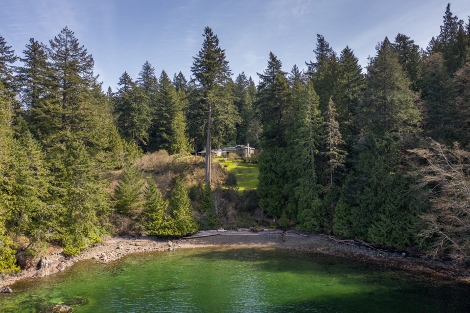 The main home overlooks its own beach.