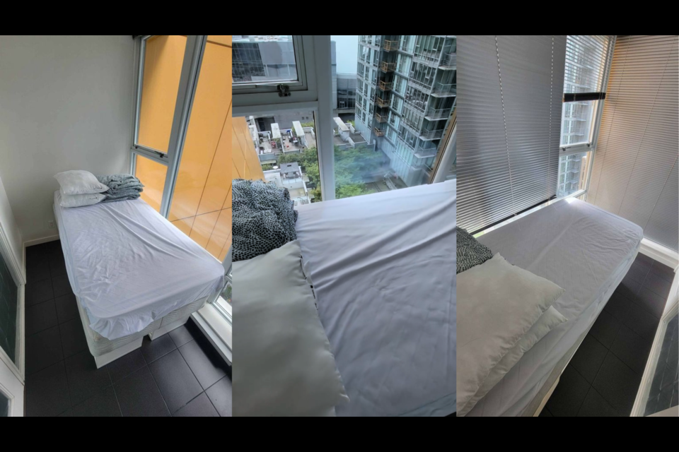 The tiny room of this Vancouver rental has enough space for a small bed; the door barely has enough room to close.