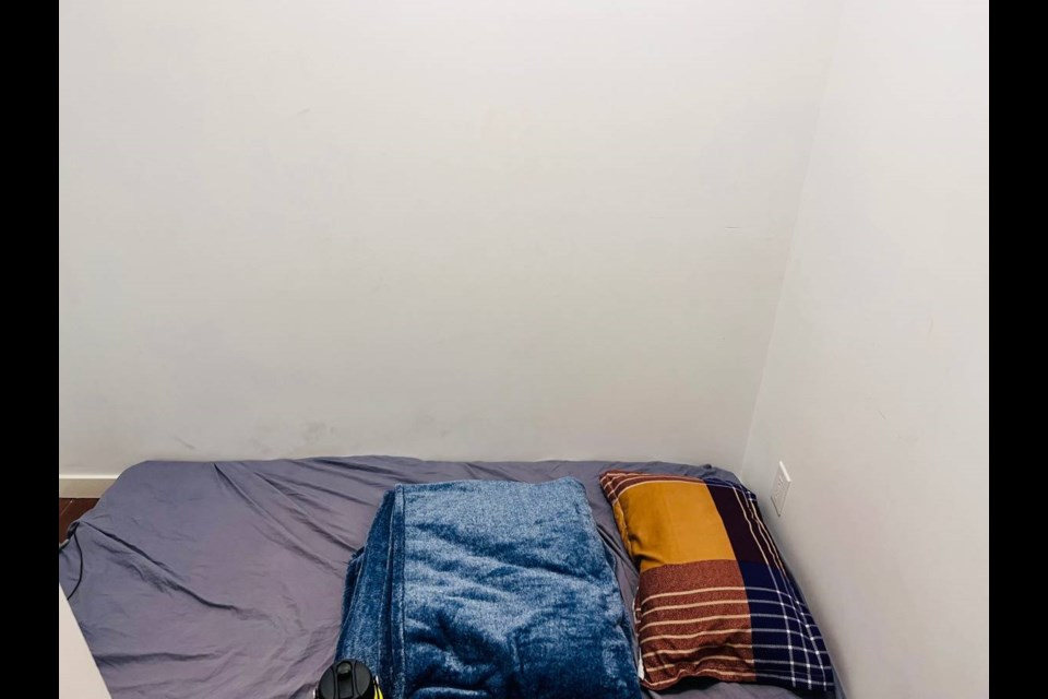 This tiny room in downtown Vancouver is just a mattress with two outlets and a small table.