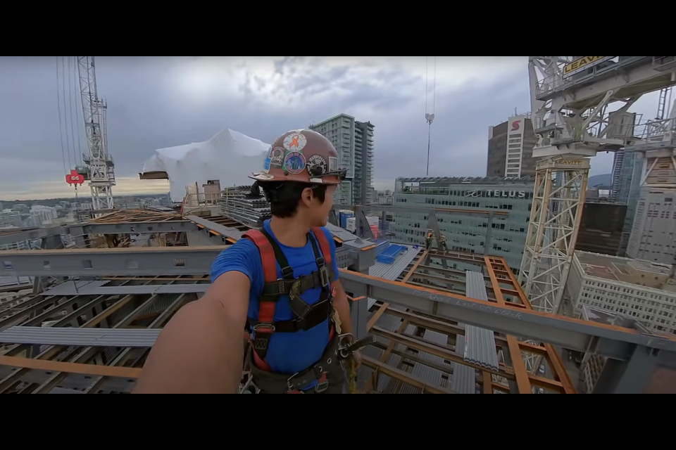 Brian Baek shows off the view from 300 feet off the ground in downtown Vancouver.