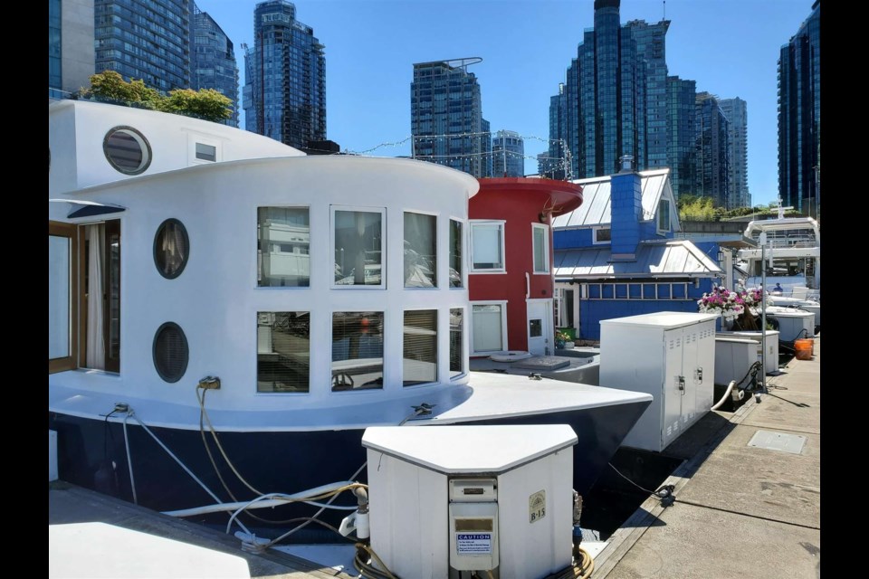 The floating home is docked in Coal Harbour in downtown Vancouver. 