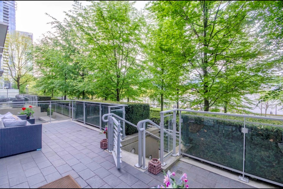 The home is a ground-level townhouse in the bottom of a Coal Harbour residential tower.