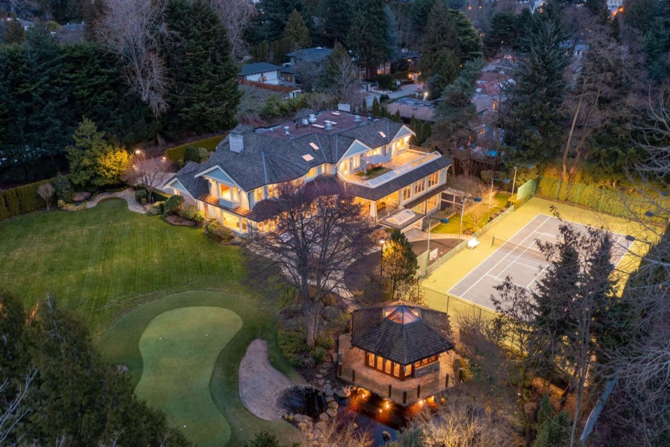 Complete with eight bedrooms and 12 bathrooms, a massive home located on W 55th Avenue sits on a 1.052-acre estate on Vancouver's West Side.