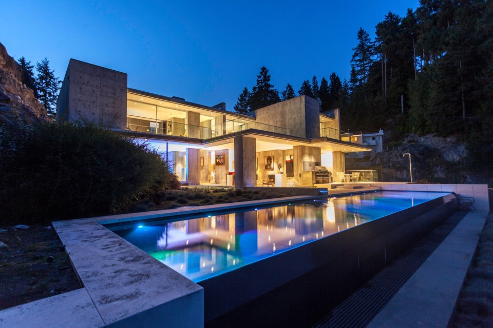 The property at 5340 Seaside Place in West Vancouver comes with access to 89 feet of shoreline, a theatre room, wine cellar and infinity pool.