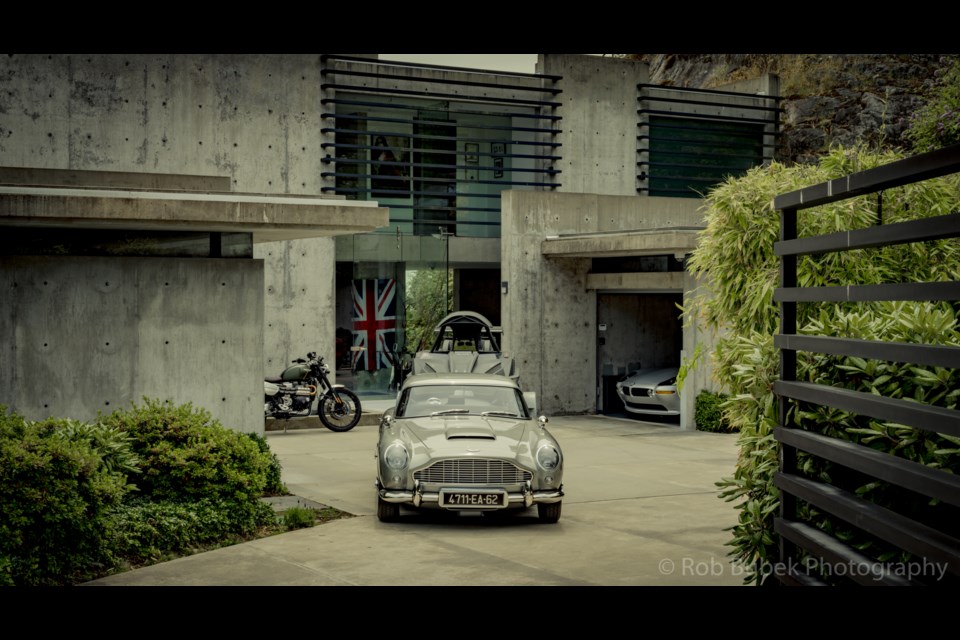 The Q car hauls the Q boat with the BMW Z8 peeking out from the garage.