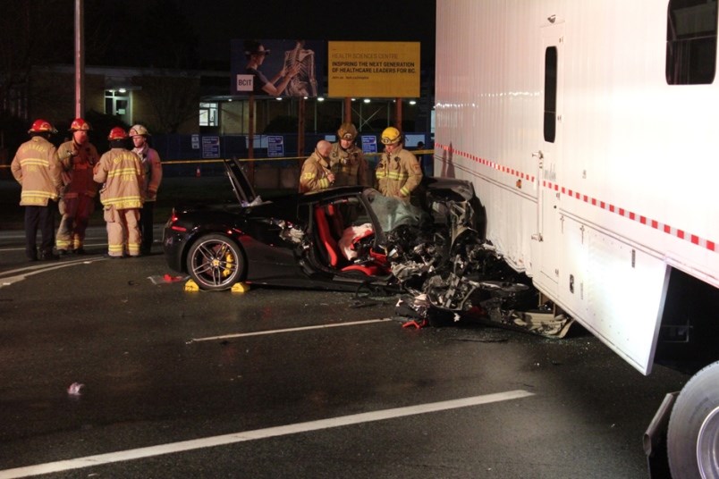 Burnaby firefighters had their hands full early Saturday morning to save two occupants of a luxury vehicle. Ryan Stelting photo