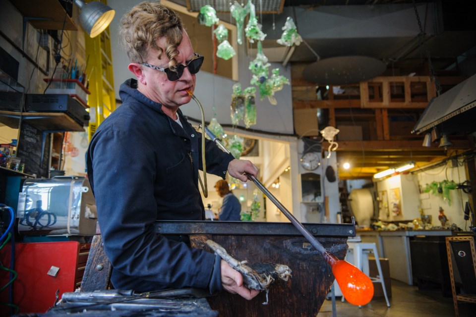 Benjamin Kikkert working on createing a plate at Vancouver Studio Glass in Granville Island on April 7, 2022.