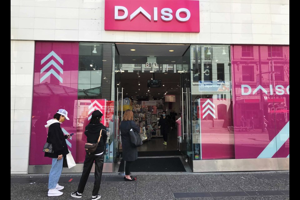 The bright pink Daiso entrance is eye-catching at the corner of Granville and Robson.