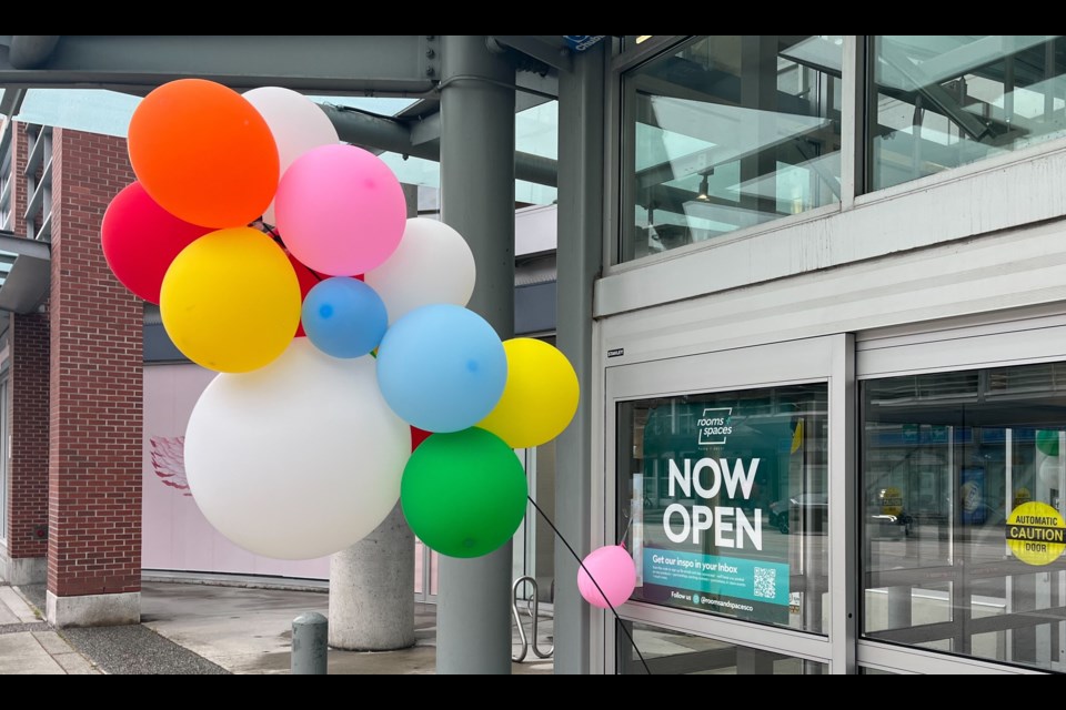 The entrance can be spotted next to some balloons.