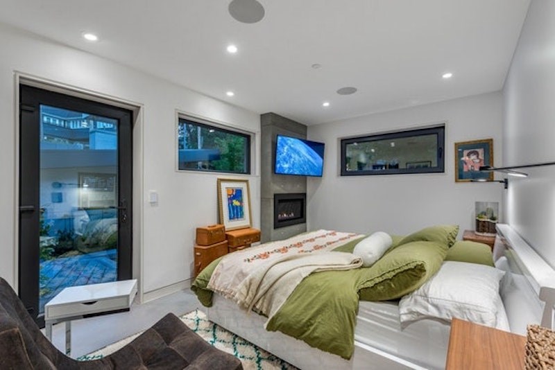 This Vancouver mansion in the Quilchena neighbourhood has rooftop patios and contemporary architecture and is listed on REW for just under $13 million.