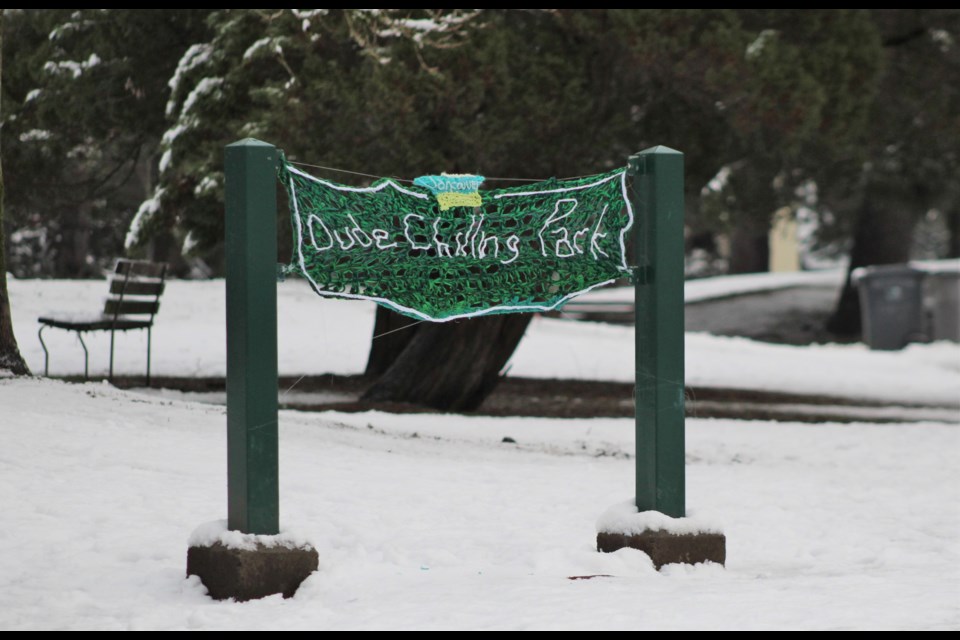 The usual 'Dude Chilling Park' sign (which is technically public art) at Guelph Park is missing, but a replacement has been strung up.