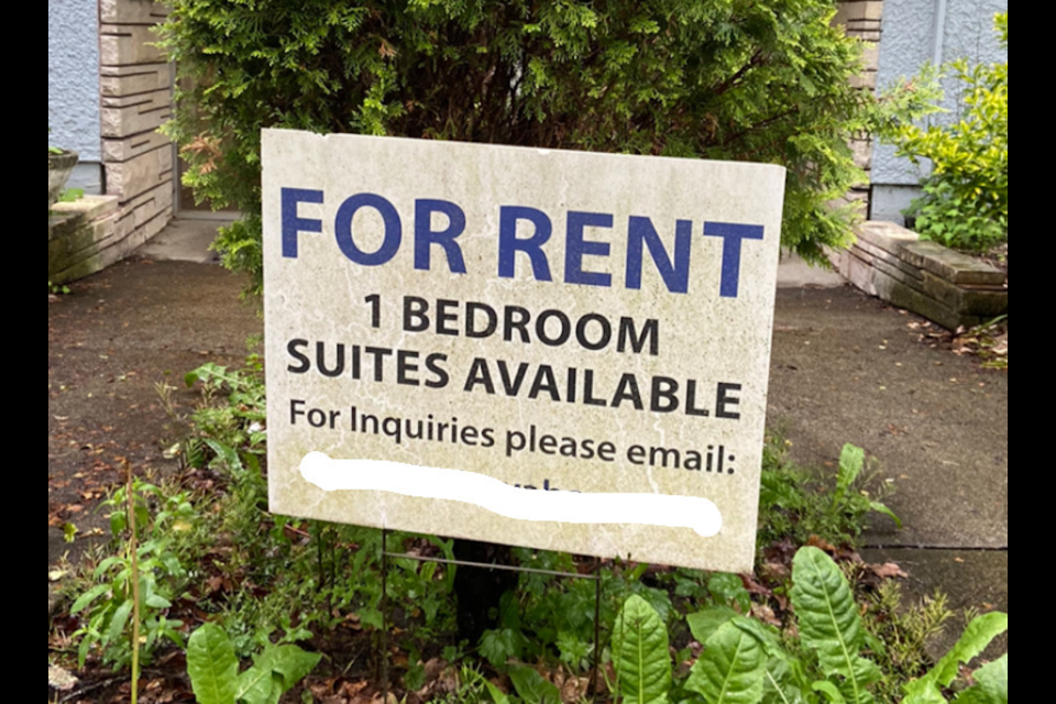 A rental sign at the front of the building. The email has been removed for privacy issues.  